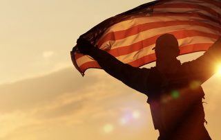 A Soldier waving the American Flag